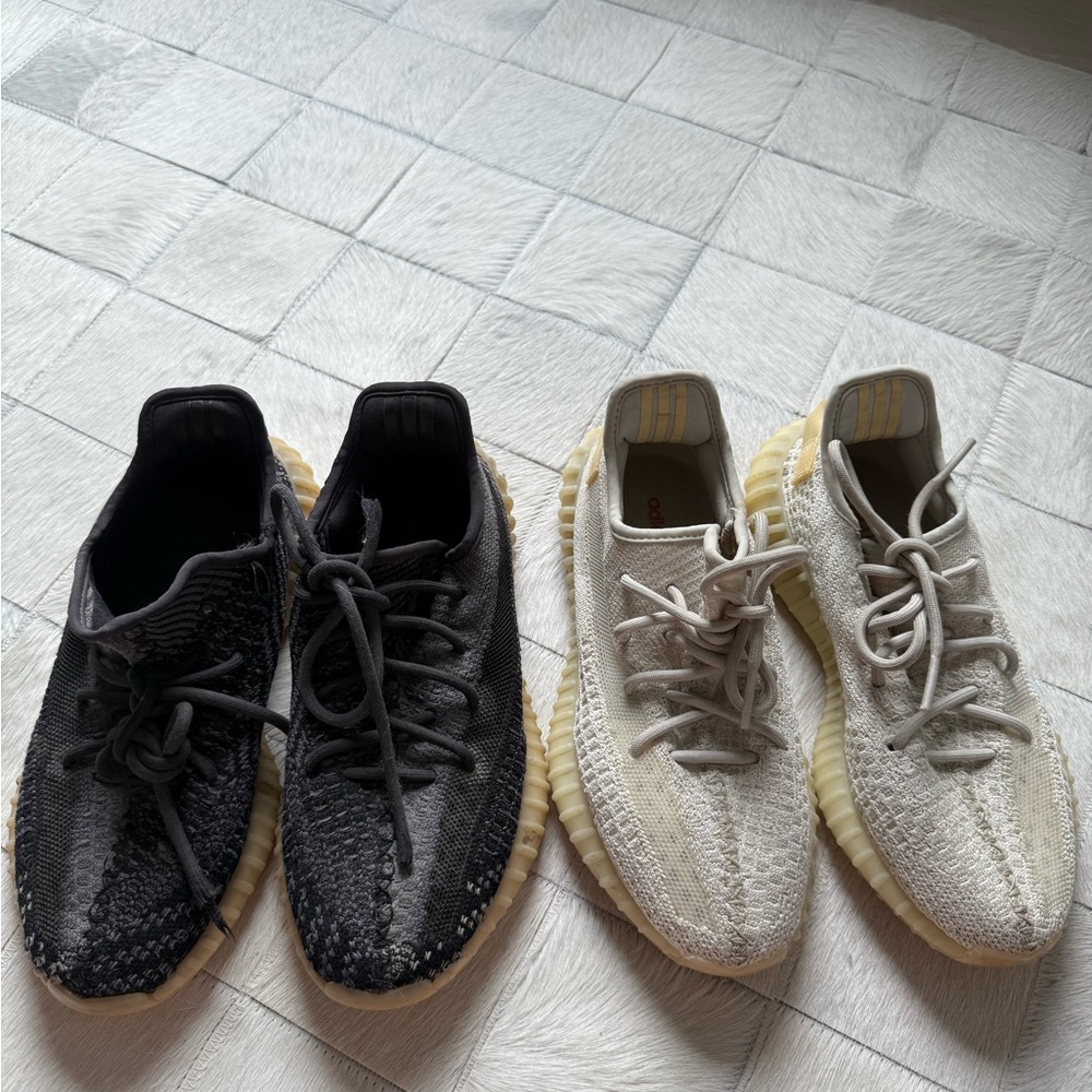 Two pairs of yeezy x adidas 350 sneakers one black one cream size 6.5 mens